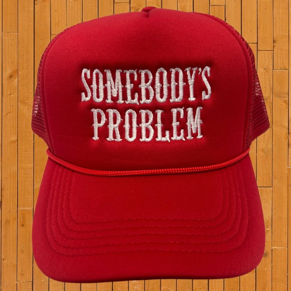 somebody_s problem red embroidered trucker hat